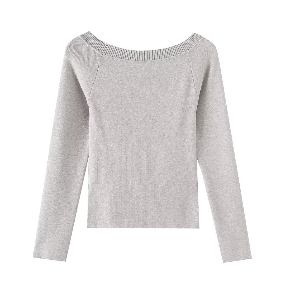 Slanted shoulder open shoulder long sleeved top