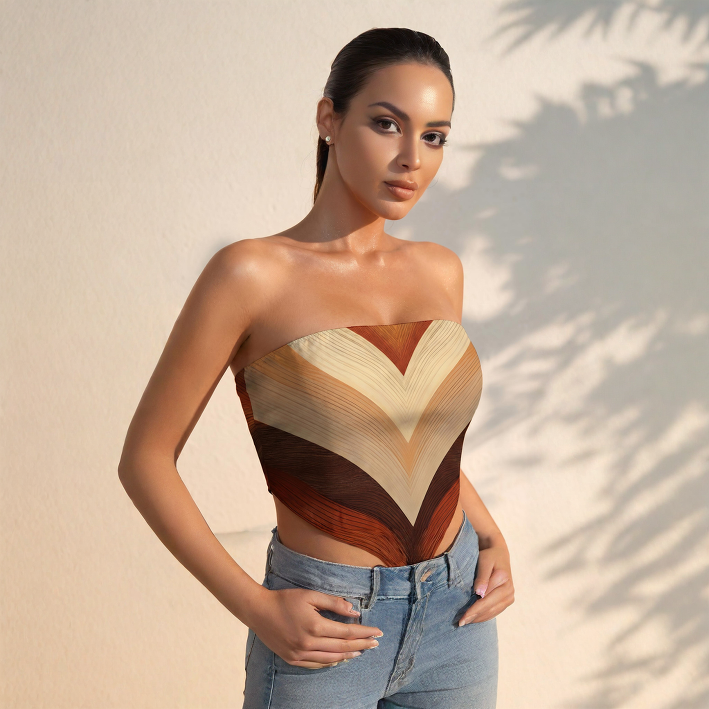 Woman wearing a strapless top with a geometric pattern against a neutral background